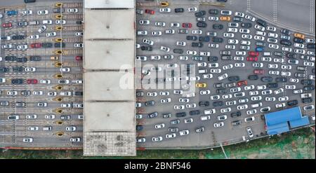 An aerial view of traffic jam on an exit of the expressway during Monday peak time after the city resumes from Spring Festival vacation, Xi'an city, n Stock Photo