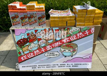 On the first day of Wuhan's re-opening, a factory owner in Wuhan put thousands of free hot dry noodles nearby Wuhan railway station, as a lovely gift Stock Photo