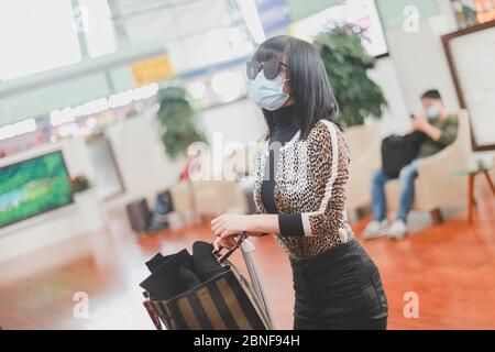 Chinese television and film actress Tan Zhuo arrives at a Chengdu airport before departure in Chengdu city, southwest China's Sichuan province, 14 Apr Stock Photo