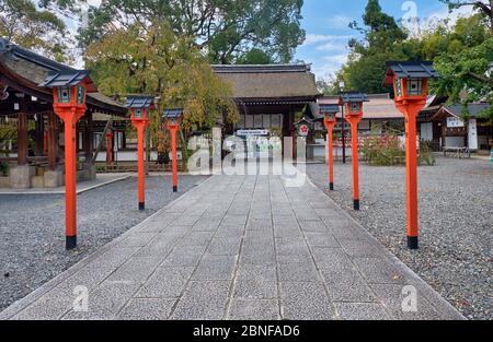 KYOTO, JAPAN - OCTOBER 17, 2019: The front way (sando) to the Hirano Shrine decorated along its course with the red lanterns.  Kyoto. Japan Stock Photo