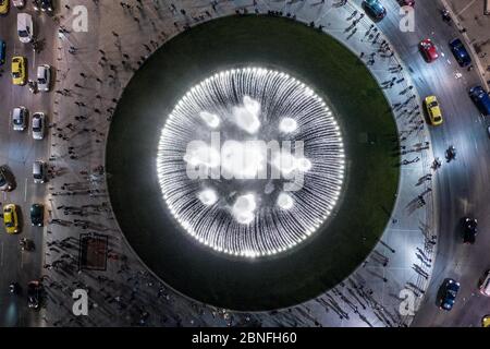 Athens. 14th May, 2020. Aerial photo taken on May 14, 2020 shows the illuminated fountain at the newly remodeled Omonia Square, a historic landmark in Athens, Greece. The new face of Omonia Square, featuring a big illuminated fountain, was unveiled on Thursday by Athens Mayor Kostas Bakoyannis. Credit: Lefteris Partsalis/Xinhua/Alamy Live News Stock Photo