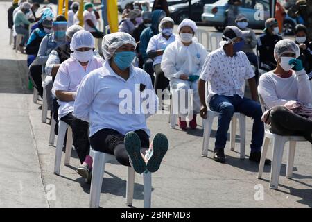 Lima, Peru. 14th May, 2020. A group of market vendors wait for blood rapid diagnostic tests for the new coronavirus disease, COVID-19 at a market in Villa El Salvador Credit: Mariana Bazo/ZUMA Wire/Alamy Live News Stock Photo