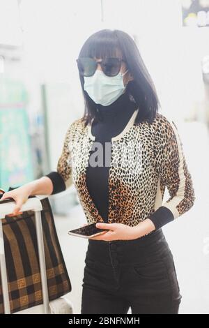 Chinese television and film actress Tan Zhuo arrives at a Chengdu airport before departure in Chengdu city, southwest China's Sichuan province, 14 Apr Stock Photo