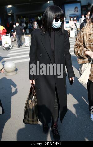 Chinese television and film actress Tan Zhuo arrives at a Changsha airport after landing in Changsha city, south China's Hunan province, 14 April 2020 Stock Photo