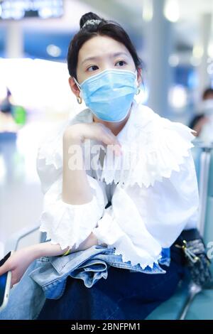 Chinese actress Zhang Ruonan arrives at a Beijing airport before