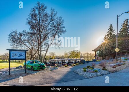 Swift Current, SK/Canada- May 14, 2020: Sunset over the carts and clubhouse ready for opening day at Elmwood Golf Course Stock Photo