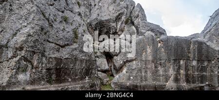 Hittite carvings on stone wall among the ruins at Yazilikaya rock shrine in Alacahoyuk, Turkey Stock Photo