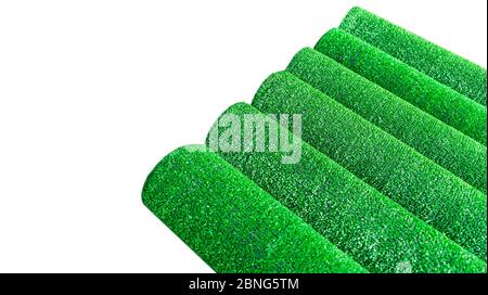 Artificial grass lawn texture isolated on white. Artificial Turf Background. Greenering with an artificial grass. Rolled artificial turf laying backgr Stock Photo