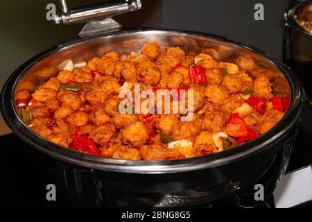 Large bowl of spicy meatball on a buffet tray. Stock Photo