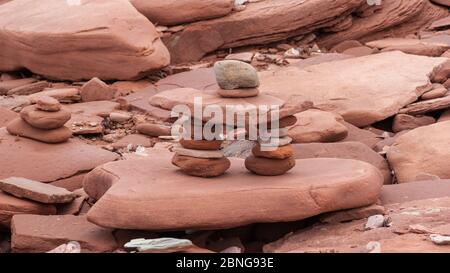Inuksuk – a manmade landmark from balancing red sandstones, at MacKenzies Brook, Prince Edward Island National Park, Canada. Stock Photo