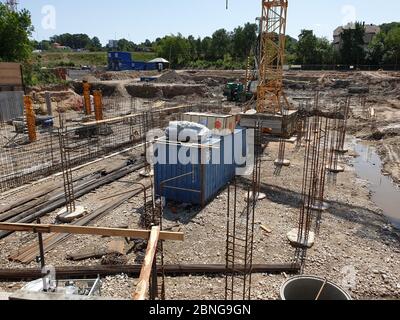 Construction site with crane and poles for the foundation Stock Photo