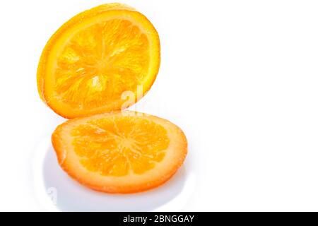 Slices Dried oranges or tangerines isolated on a white background. Vegetarianism and healthy eating Stock Photo