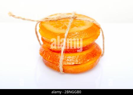Slices Dried oranges or tangerines isolated on a white background. Vegetarianism and healthy eating Stock Photo