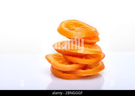 Slices Dried oranges or tangerines isolated on a white background. Vegetarianism and healthy eating Stock Photo