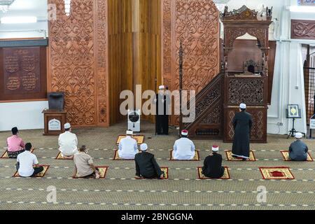 Seremban, NEGERI SEMBILAN, MALAYSIA. 15th May, 2020. Muslim clerics performs a congregational Friday prayer at the State Mosque in Seremban, for the first time since the Movement Control Order (MCO) was implemented last March 18.The Religious Affairs Minister earlier allowed Friday prayers, alongside other prayers to be performed during the Conditional Movement Control Order (CMCO) at mosques nationwide with limited attendees and social distancing measures being put in place. Credit: Fuad Nizam/ZUMA Wire/Alamy Live News Stock Photo