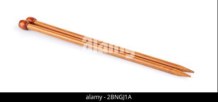 A pair of large wooden knitting needles isolated on white background Stock Photo