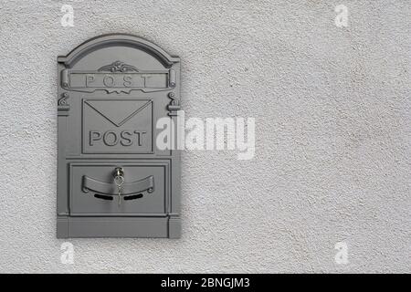 Vintage metal mail box on brick wall Stock Photo