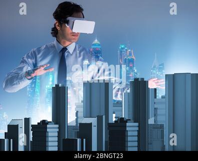 The man with virtual reality goggles doing urban planning Stock Photo