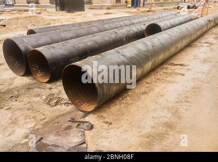 Laying installation of underground utilities in a drainage plastic pipe ...