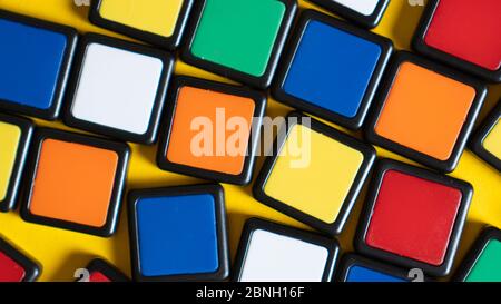 Scattered colorful squares as background. Backdrop for smart and educational games. Kid's imagination concept. Stock Photo