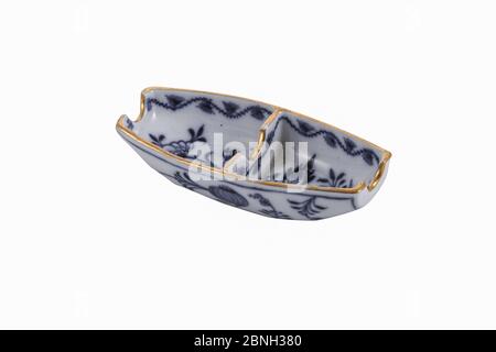 Closeup of a ceramic vintage ashtray under the lights isolated on a white background Stock Photo