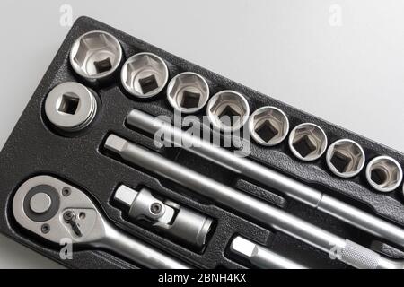 Socket wrench toolbox background. Industrial Socket Set inside Toolbox, Ratchet Socket Kit.Shallow depth of field Stock Photo