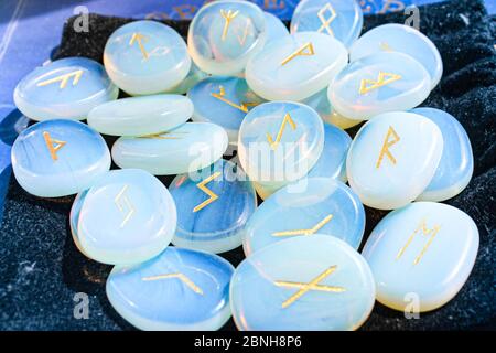 Set of runes for fortune telling laid out on a table. Stock Photo