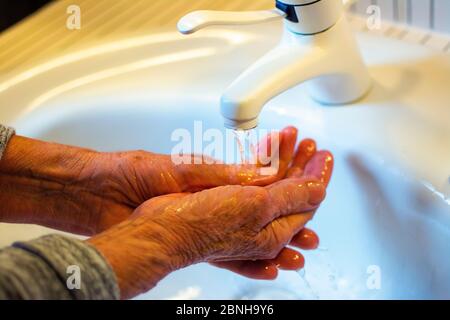 Washing hands in the bathroom Stock Photo