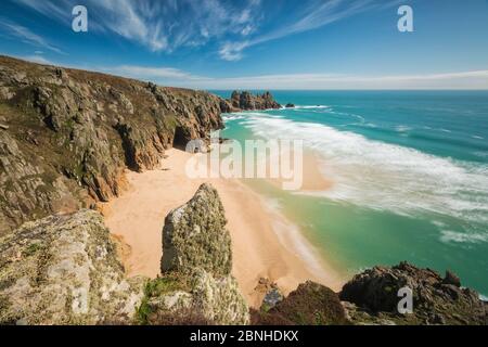 Pedn Vounder Beach and Logan Rock, Porthcurno, Cornwall, England, UK. April 2014. Stock Photo