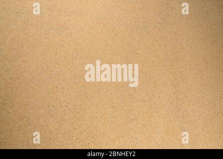 Beige texture. Background of sand with dark splashes. Stock Photo