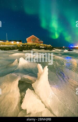 Northern lights over Andenes village,  Andenes, Andoya island, North Atlantic Ocean, Norway, January 2016 Stock Photo