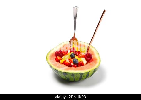 Watermelon filled with fresh fruit salad. isolated on white background Stock Photo