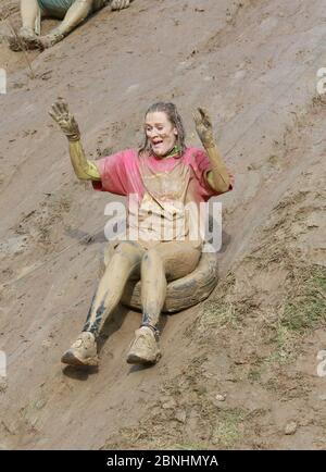 The 'Nuts Challenge' charity event. The race takes place in Surrey, England where competitors negotiate hill slides, rope swinging, balancing, tunnel Stock Photo