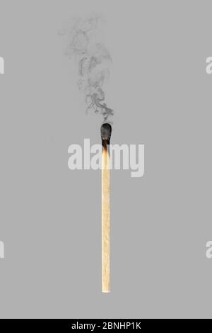 burned match with smoke isolated on gray background Stock Photo