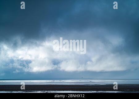 Pastel shades of sea and sandy beach of the seashore by Bristol Channel at Burnham-on-Sea, Somerset, UK Stock Photo