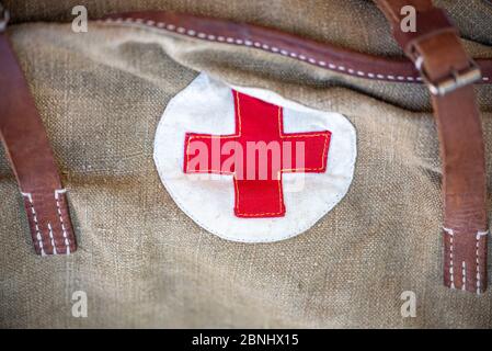 Close-up vintage military bag with a red cross. Soviet bag for medicines. Old bag for the military. The Second World War Stock Photo
