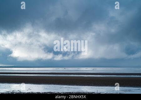 Pastel shades of sea and sandy beach of the sea shore by the Bristol Channel at Burnham-on-Sea, Somerset, UK Stock Photo