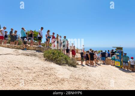 ZAKYNTHOS, GREECE - JULY 21, 2018: Tourists in a que to take a photo of a famous beach with shipwreck in Zakynthos island Stock Photo