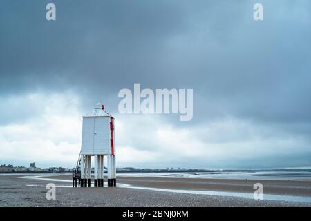 The Low Lighthouse - wooden structure built on stilts in 19th Century overlooking the Bristol Channel at Burnham-on-Sea seashore, Somerset, UK Stock Photo