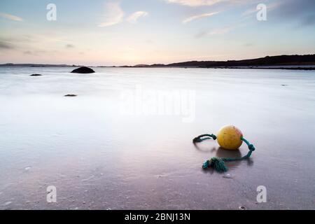 Dusk on Old Quay, St. Martin's Flats, with buoy in shallows. St. Martin's, Isles of Scilly. England. May 2013. Stock Photo