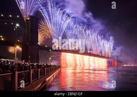 New York City, NY, USA - July 04, 2019: 4th of July Independance Day Fireworks (Macys) over the Brooklyn Bridge. Lower Manhattan Stock Photo