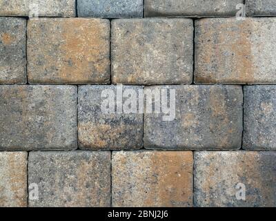 Bricks, paving stones, stacked as a wall, as a background. Stock Photo