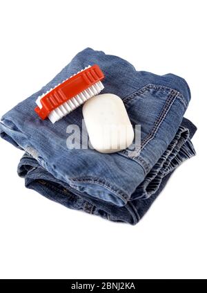 Blue jeans with soap and brush cleaning concept Stock Photo