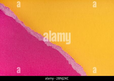 Pieces of torn ragged purple paper edges on yellow background. Ripped cracked paper edge isolated with soft shadow. Paper piece torn edge. Copy space, Stock Photo