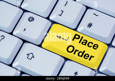 A computer keyboard with words PLACE ORDER on a yellow enter key.  Online shopping concept. Stock Photo