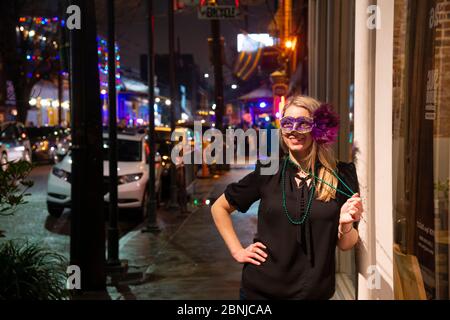 Woman ready to celebrate Mardis Gras on Frenchmen Street, the jazz district of New Orleans, Louisiana, United States of America, North America Stock Photo