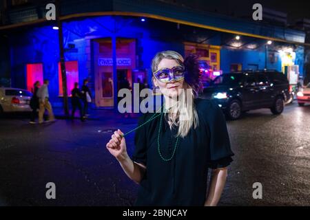 Woman ready to celebrate Mardis Gras on Frenchmen Street, the jazz district of New Orleans, Louisiana, United States of America, North America Stock Photo