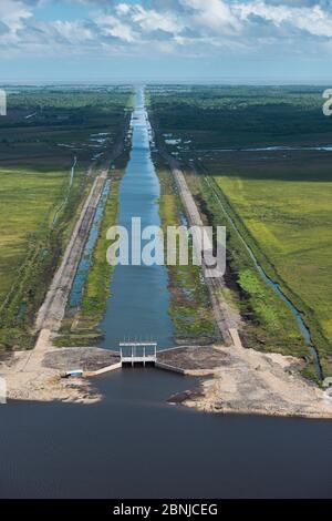 Hope canal, an irrigation canal in East Demerara Water Conservancy (for sugar cane and rice production) coastal area of Guyana, South America Stock Photo