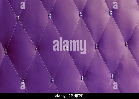 Soviet soft purple dermantine front door with a banner of fishing line and nails - full frame background and texture Stock Photo