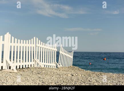 white fence on the beach by the sea on the beach, sea view Stock Photo